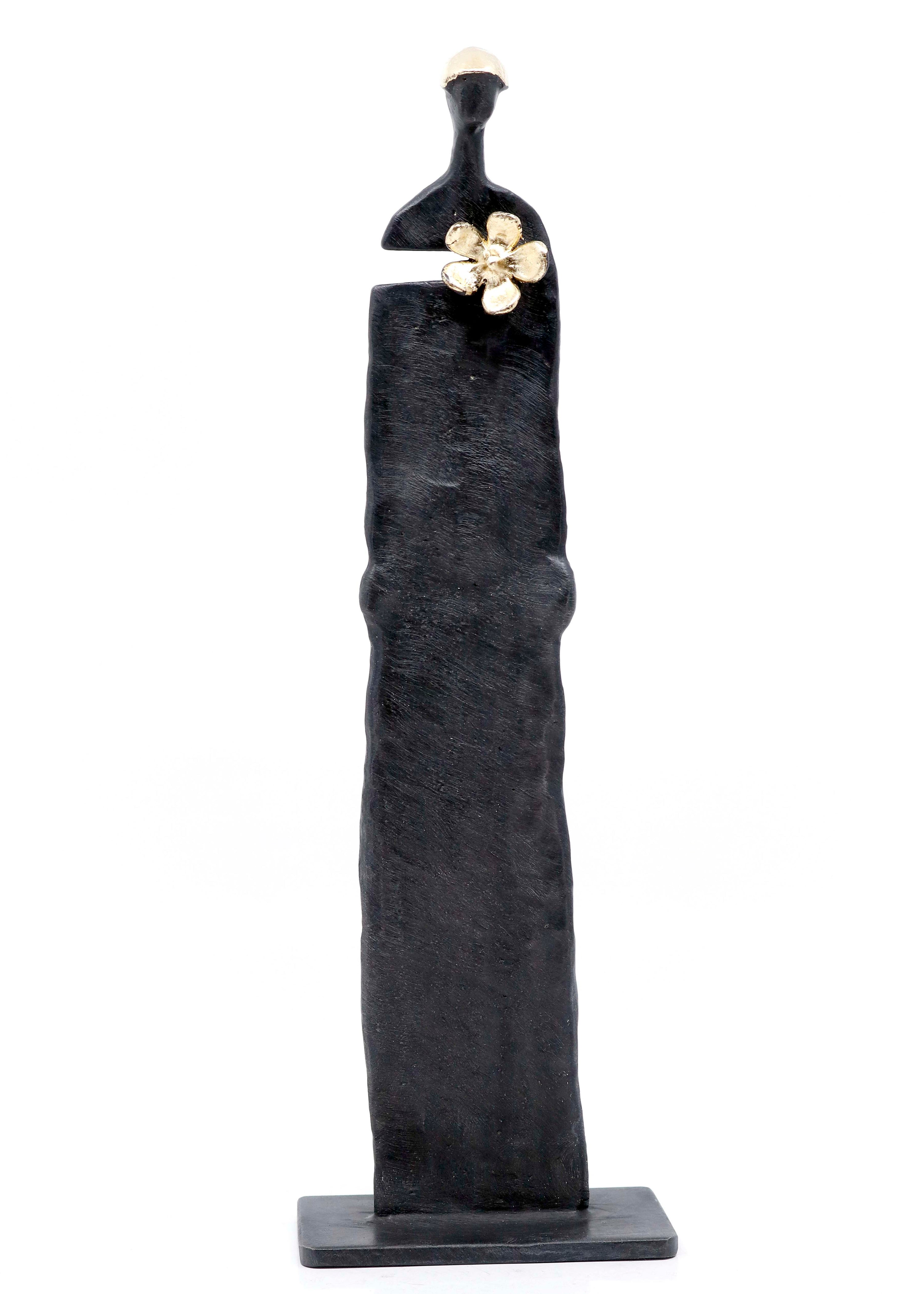 Med blomst i knapphullet